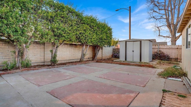 view of patio / terrace with a storage shed