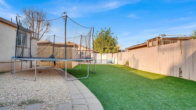 view of yard with a trampoline