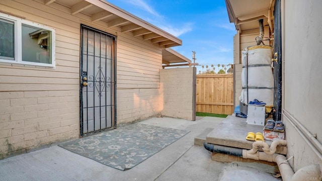 property entrance with a patio area