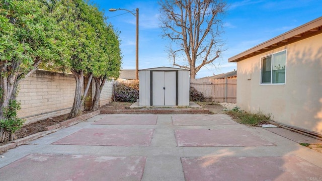 view of patio / terrace with a storage unit