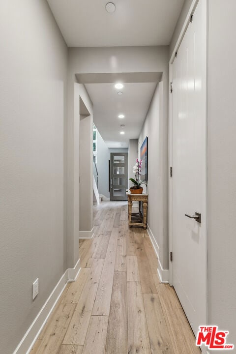 hallway featuring light hardwood / wood-style flooring