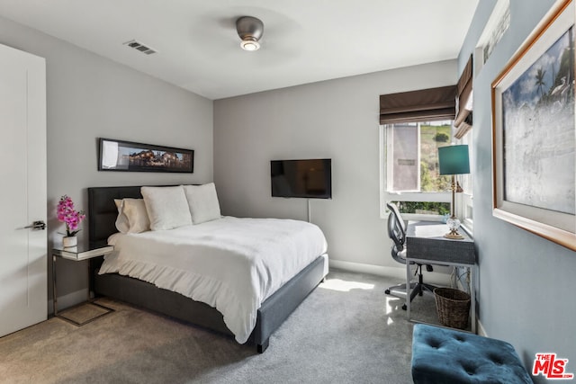 bedroom featuring ceiling fan and carpet floors