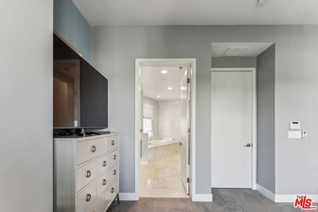 carpeted bedroom with ensuite bath