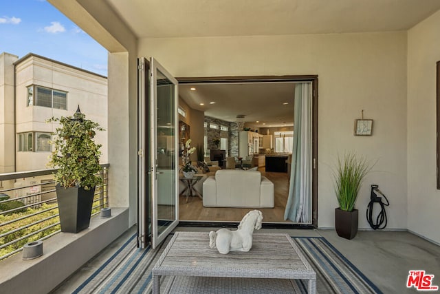 doorway to property featuring a balcony