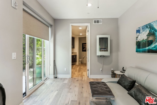 living room with light hardwood / wood-style flooring