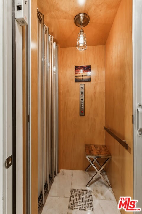 hallway with light tile patterned floors