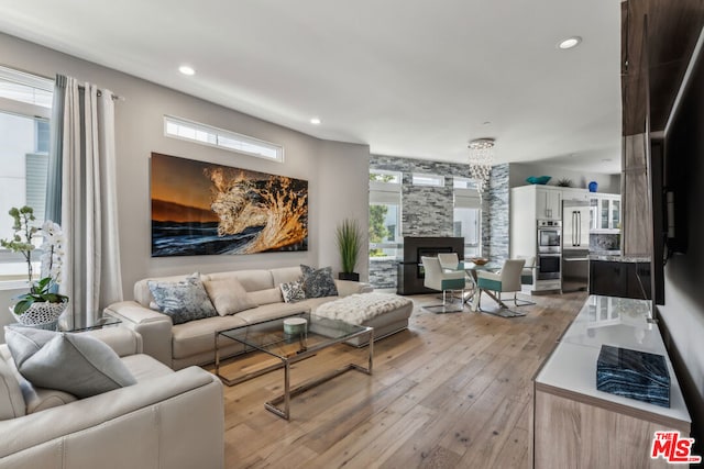 living room featuring a fireplace and light hardwood / wood-style floors