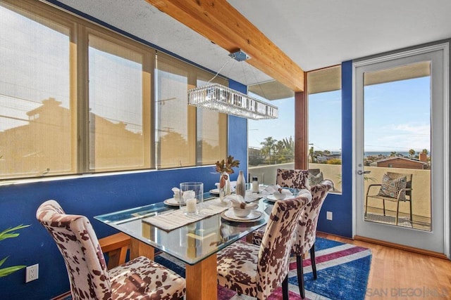 sunroom / solarium with beamed ceiling