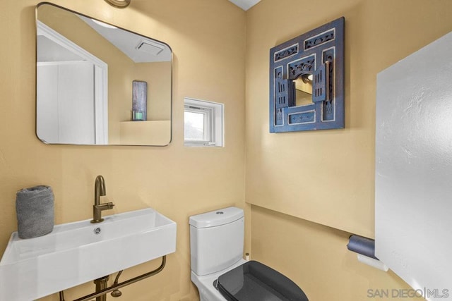 bathroom with sink and toilet