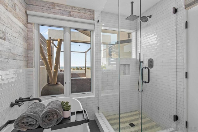 bathroom featuring a shower with shower door