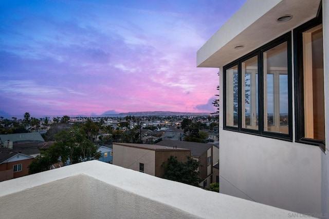 view of balcony at dusk