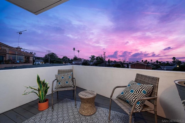 patio terrace at dusk with a balcony