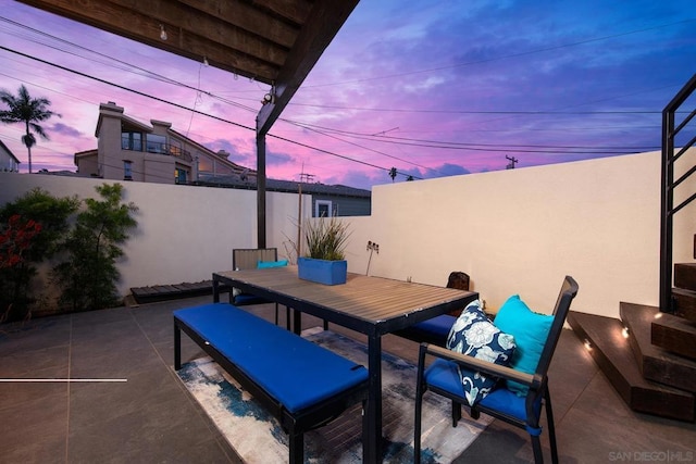 view of patio terrace at dusk