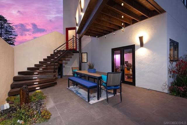 view of patio terrace at dusk