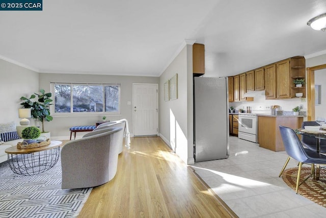 living room with crown molding and light hardwood / wood-style floors