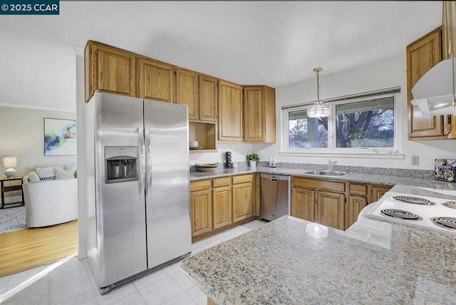 kitchen with hanging light fixtures, sink, kitchen peninsula, and appliances with stainless steel finishes