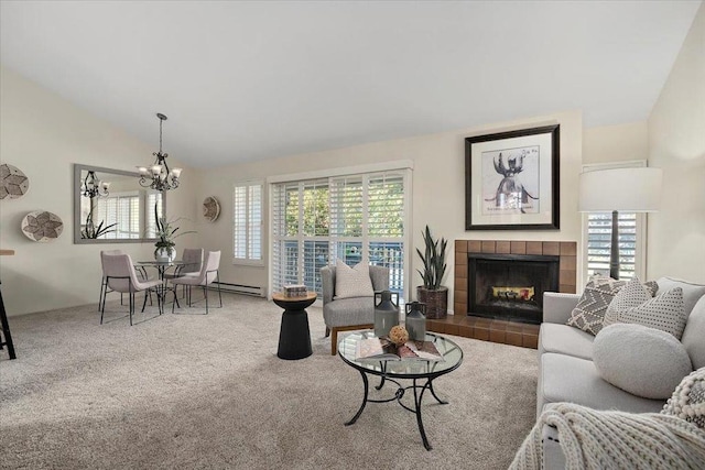 living room with vaulted ceiling, a baseboard radiator, carpet flooring, a chandelier, and a tiled fireplace