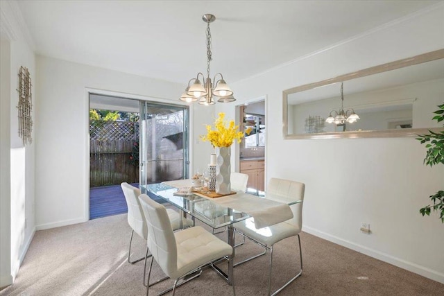 dining room featuring an inviting chandelier and carpet