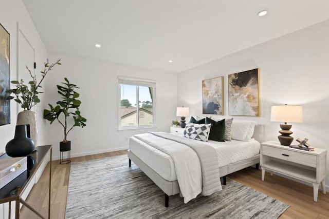 bedroom with wood-type flooring