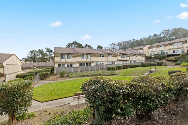 view of community featuring a lawn