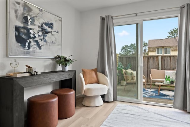 sitting room featuring light hardwood / wood-style flooring