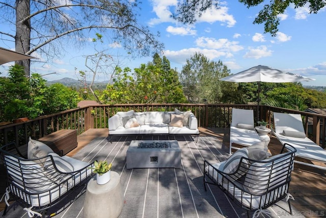 wooden deck with an outdoor living space