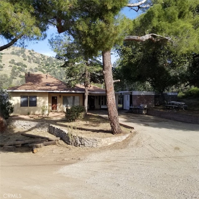 view of front of home featuring a mountain view