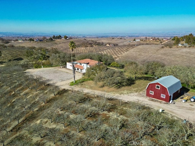 birds eye view of property featuring a rural view