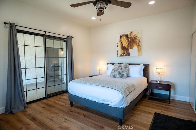 bedroom with recessed lighting, a ceiling fan, baseboards, and wood finished floors