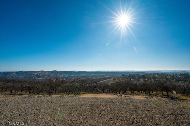 property view of mountains featuring a rural view