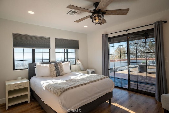 bedroom featuring recessed lighting, visible vents, dark wood finished floors, and access to outside