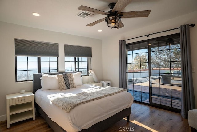 bedroom featuring recessed lighting, visible vents, access to exterior, and dark wood finished floors