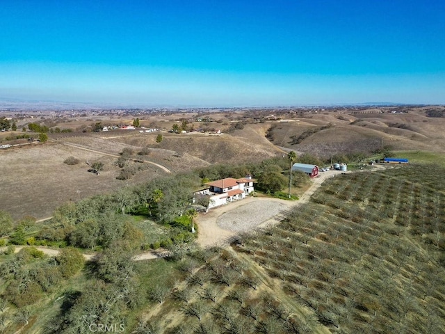 birds eye view of property featuring a rural view