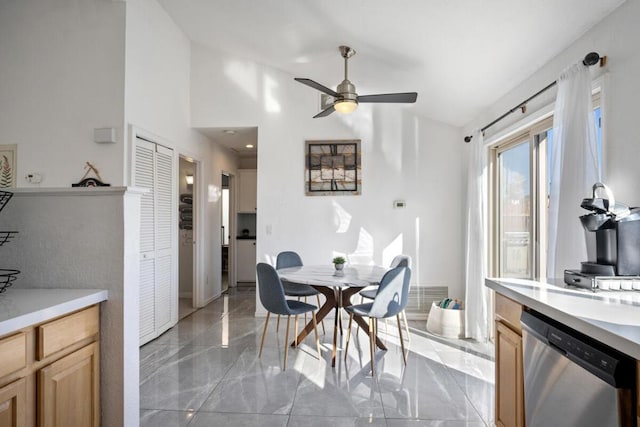 dining space featuring lofted ceiling and ceiling fan