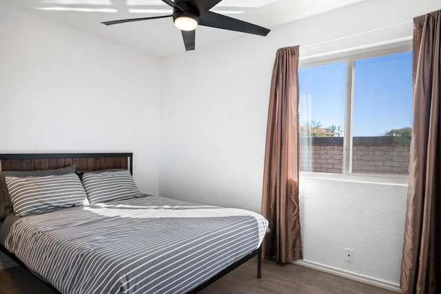 bedroom featuring dark hardwood / wood-style floors and ceiling fan