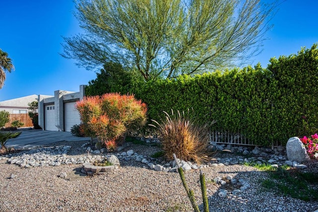 view of yard with a garage