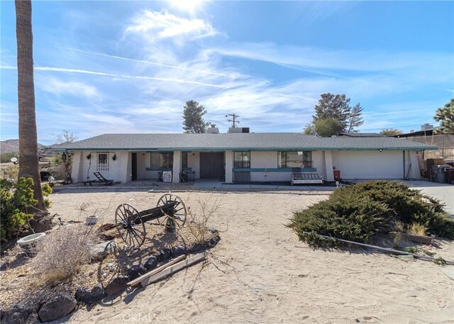 ranch-style house with a patio