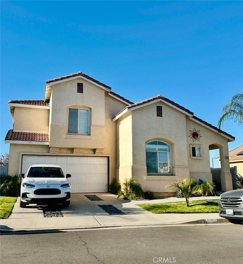 mediterranean / spanish-style house featuring a garage