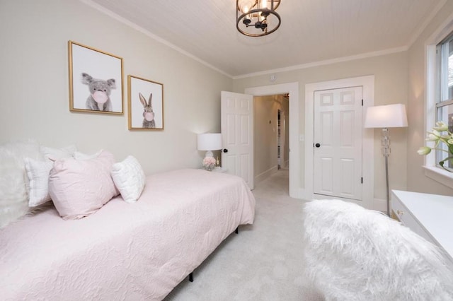 carpeted bedroom featuring crown molding and a chandelier