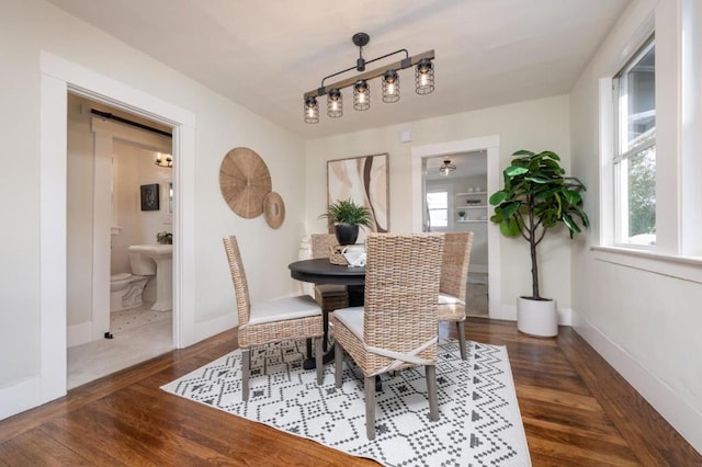 dining area with dark hardwood / wood-style floors