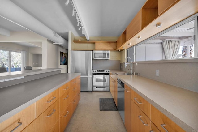 kitchen with appliances with stainless steel finishes and sink