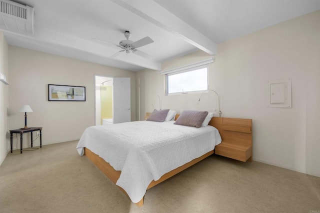 bedroom with ceiling fan and beam ceiling