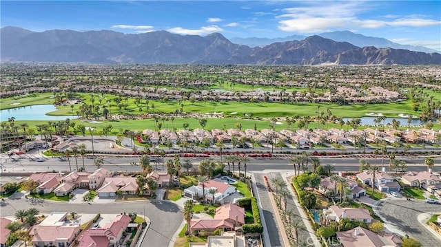 birds eye view of property featuring a water and mountain view