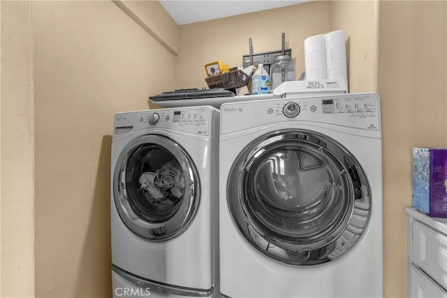 laundry area featuring washing machine and dryer