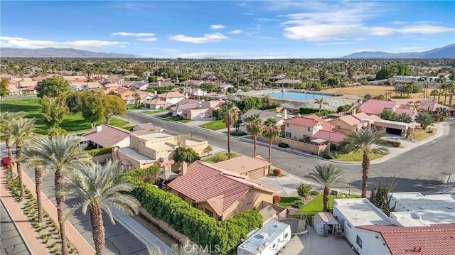 birds eye view of property featuring a mountain view