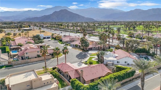 birds eye view of property with a mountain view