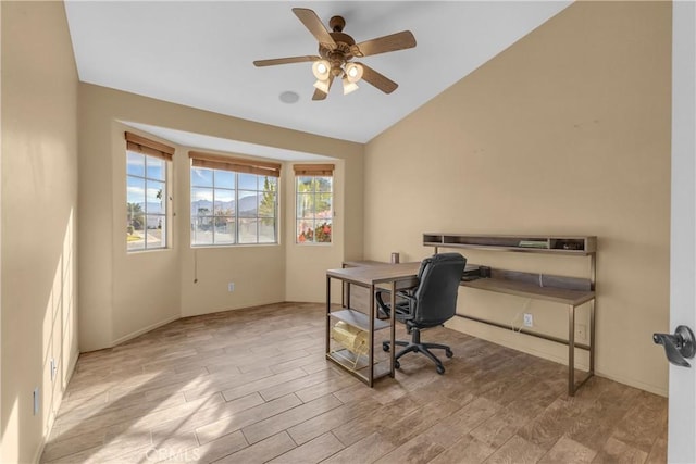 office featuring lofted ceiling, light hardwood / wood-style floors, and ceiling fan