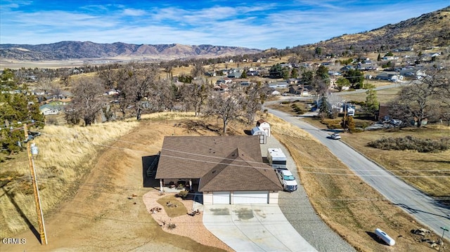 birds eye view of property featuring a mountain view