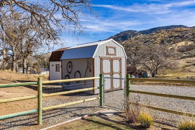 view of outbuilding with a mountain view