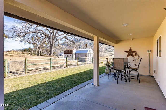 17600 Ascot Ct, Tehachapi, CA 93561 - fenced backyard with a patio, a storage shed, and outdoor dining area